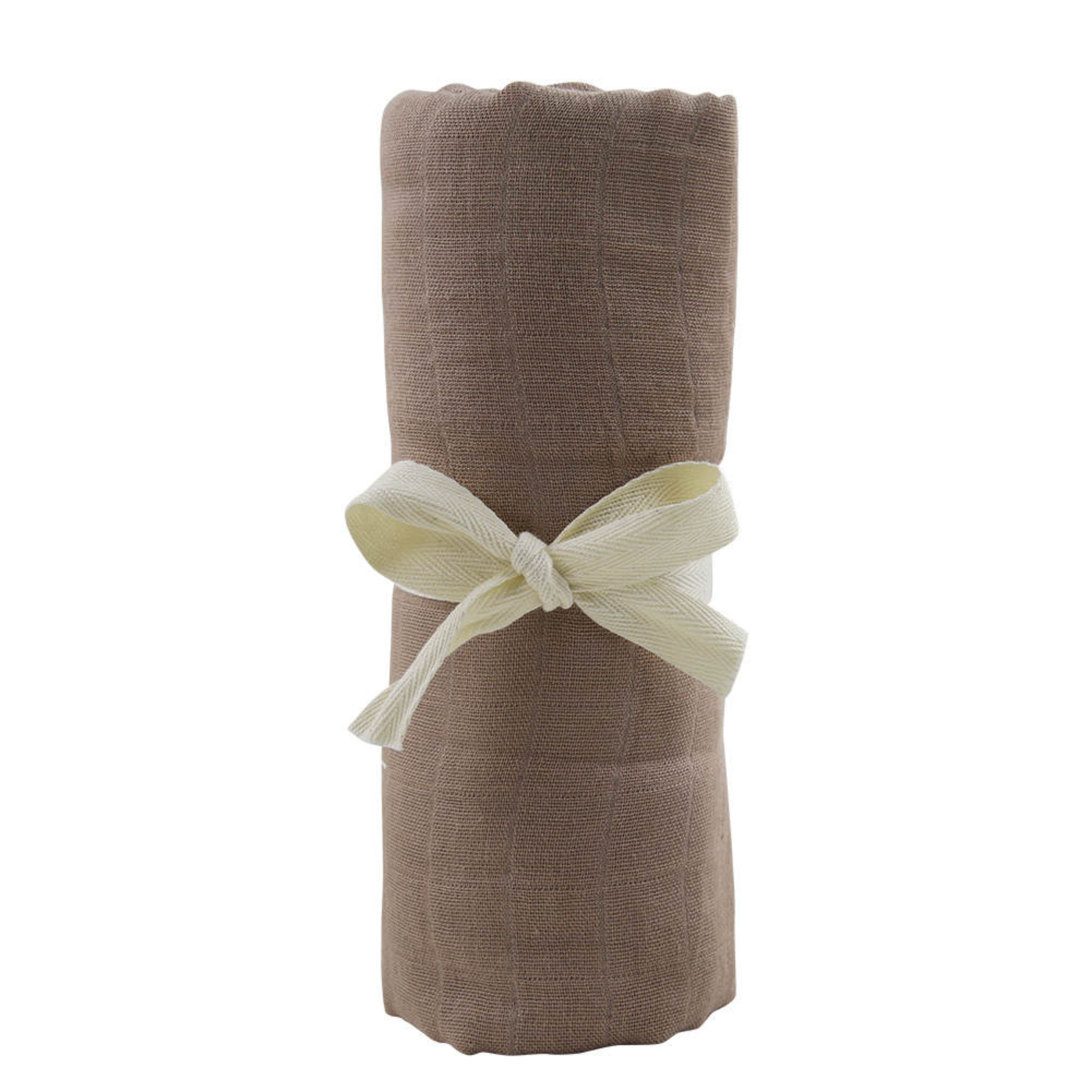Bamboo muslin baby swaddle in sage, naturally soft and sustainably made by Giften Market, rolled and tied with a ribbon.