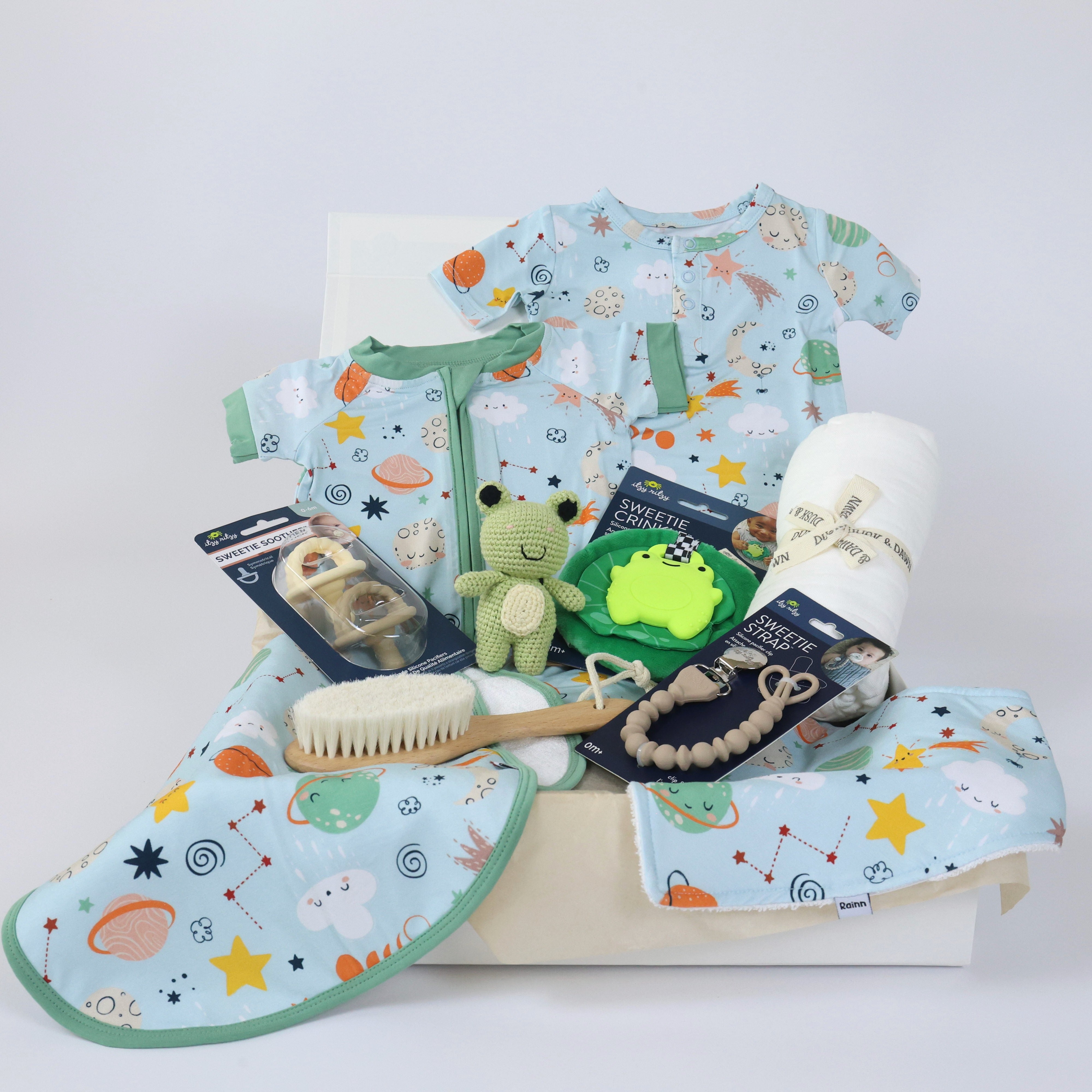 Baby Gift Set For Boys featuring bamboo babywear and essentials with cosmic designs, perfect for showers and birthdays in a white reusable box.