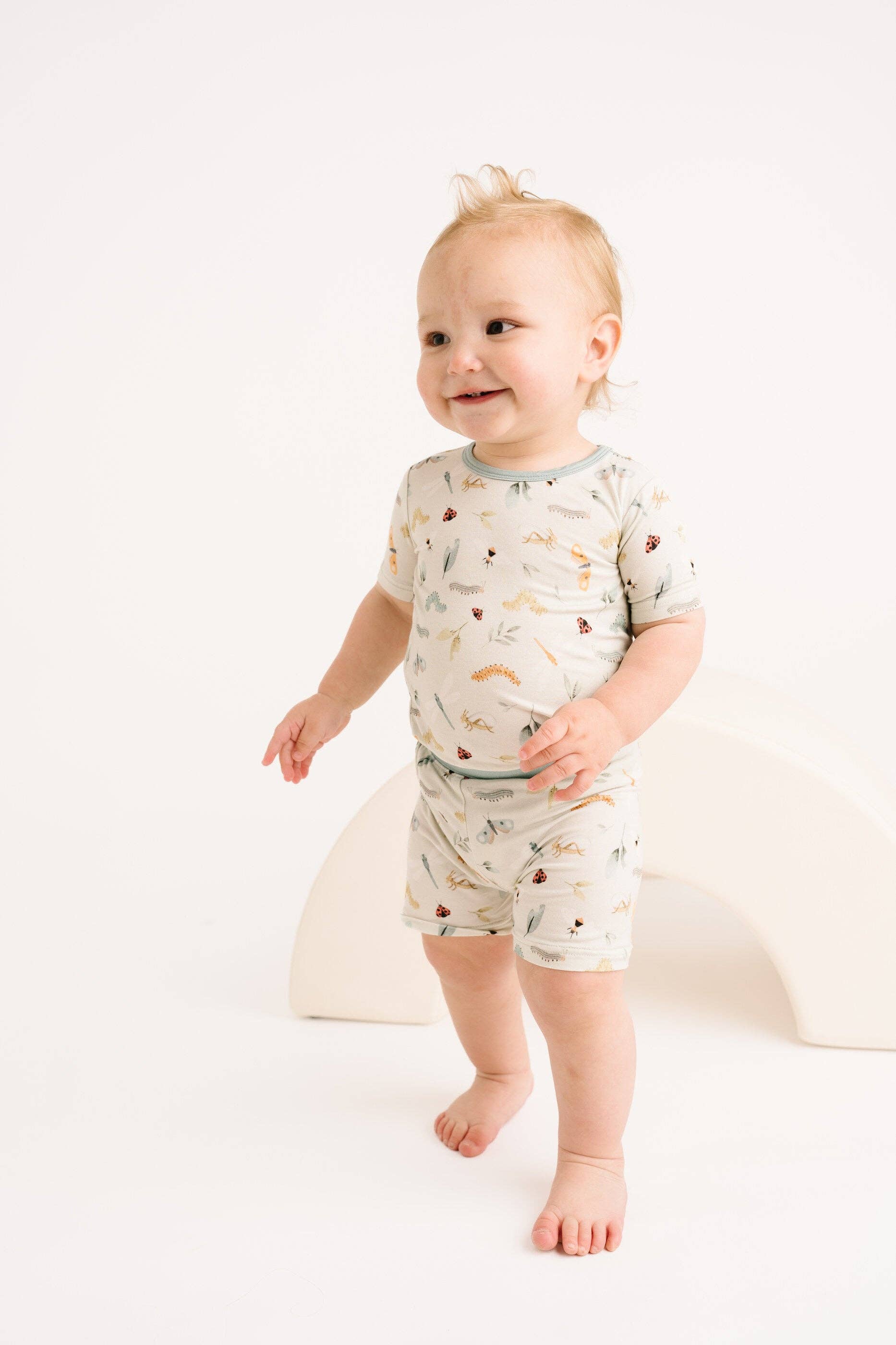 Baby wearing Bug Buddies Bamboo Shorts Set by Little One Shop, showcasing comfy and stylish design for 12-18 months.