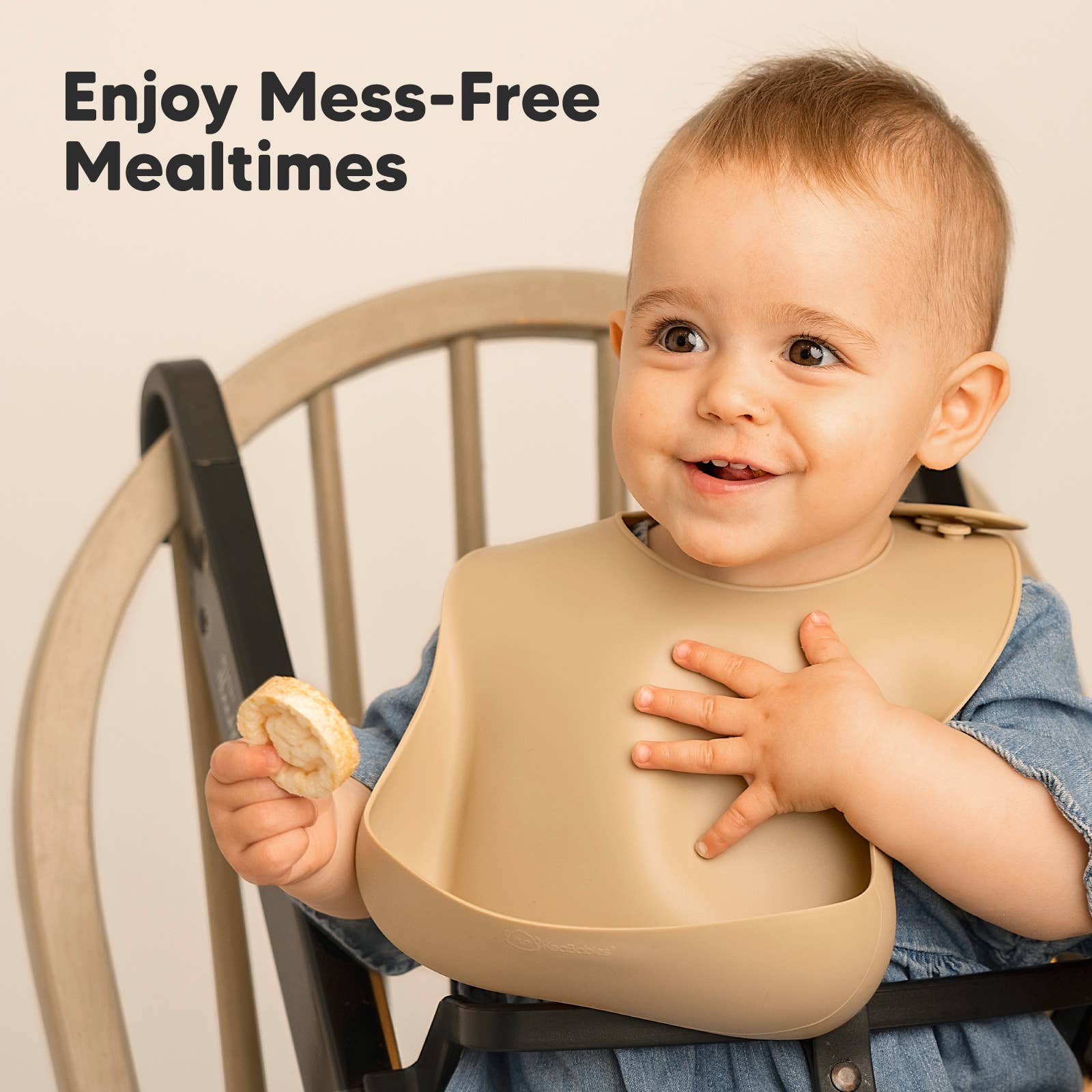 Smiling baby wearing Silicone Bibs enjoying mess-free mealtime in a high chair. Perfect for toddlers and everyday use.