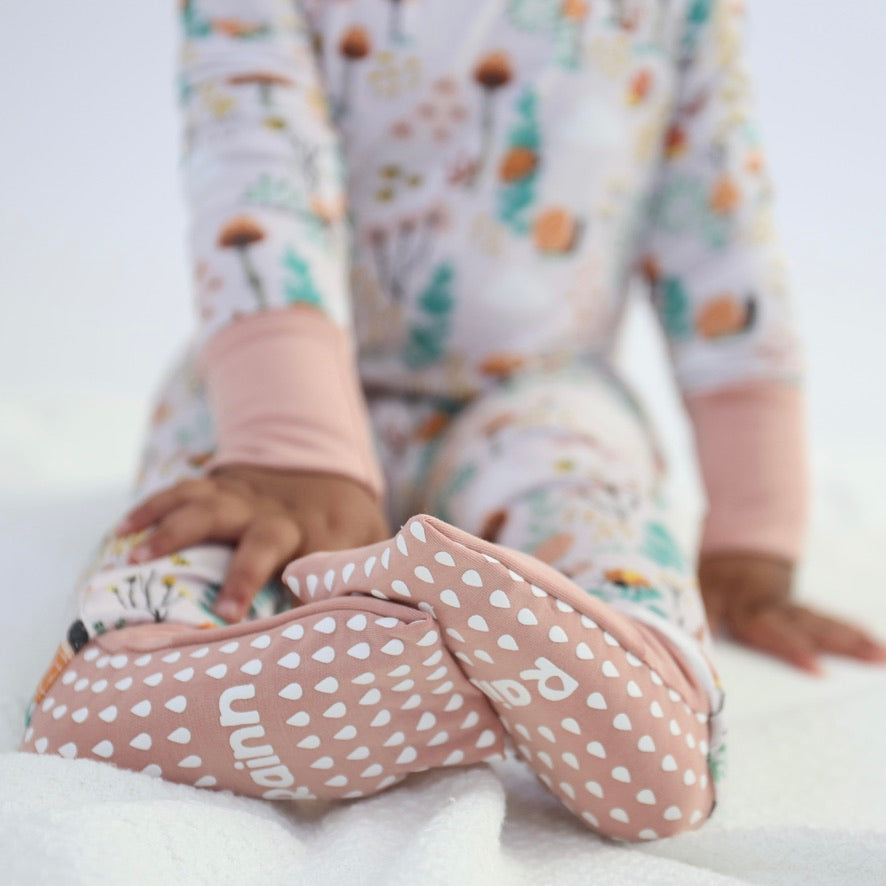 Baby in bamboo crescent zipp jammies - fern, breathable and hypoallergenic, designed for comfy sleep and sensitive skin.